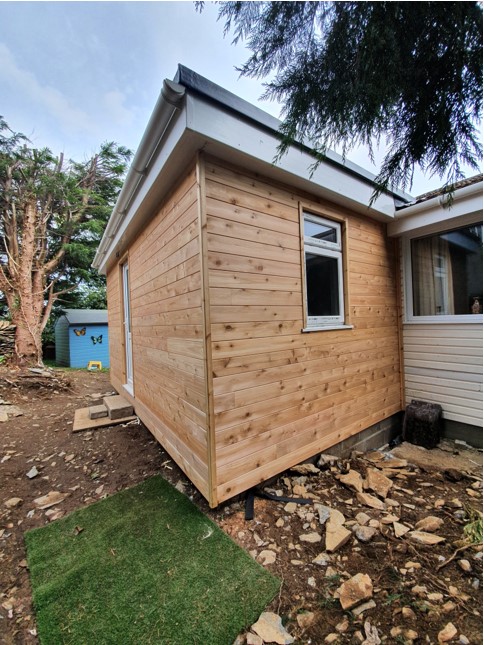 This timber frame extension increases space and usability.